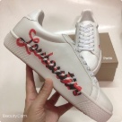 sneakers White Red Black White sneakers with red and black lettering on side sneakers