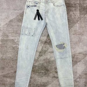 Distressed Light Blue Skinny Jeans with Rhinestone Detail by