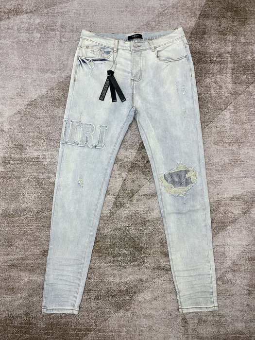 Distressed Light Blue Skinny Jeans with Rhinestone Detail by