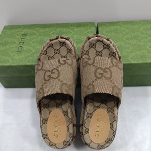 Gucci Women's GG Logo Canvas Slide Sandals in Beige