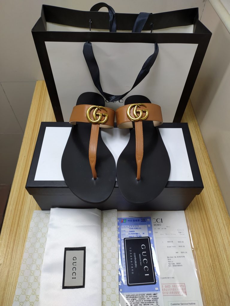 Gucci Women’s Brown Leather Flip Flops with Logo Detail