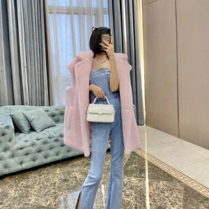 Pink-Faux-Fur-Vest-with-Denim-Jumpsuit-and-White-Handbag-for