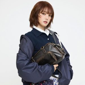 Navy-Quilted-Bomber-Jacket-with-Black-Crossbody-Bag-and-Flor