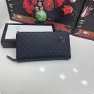 clutch bag Gucci zip around embossed leather wallet Black Size 19x10cm